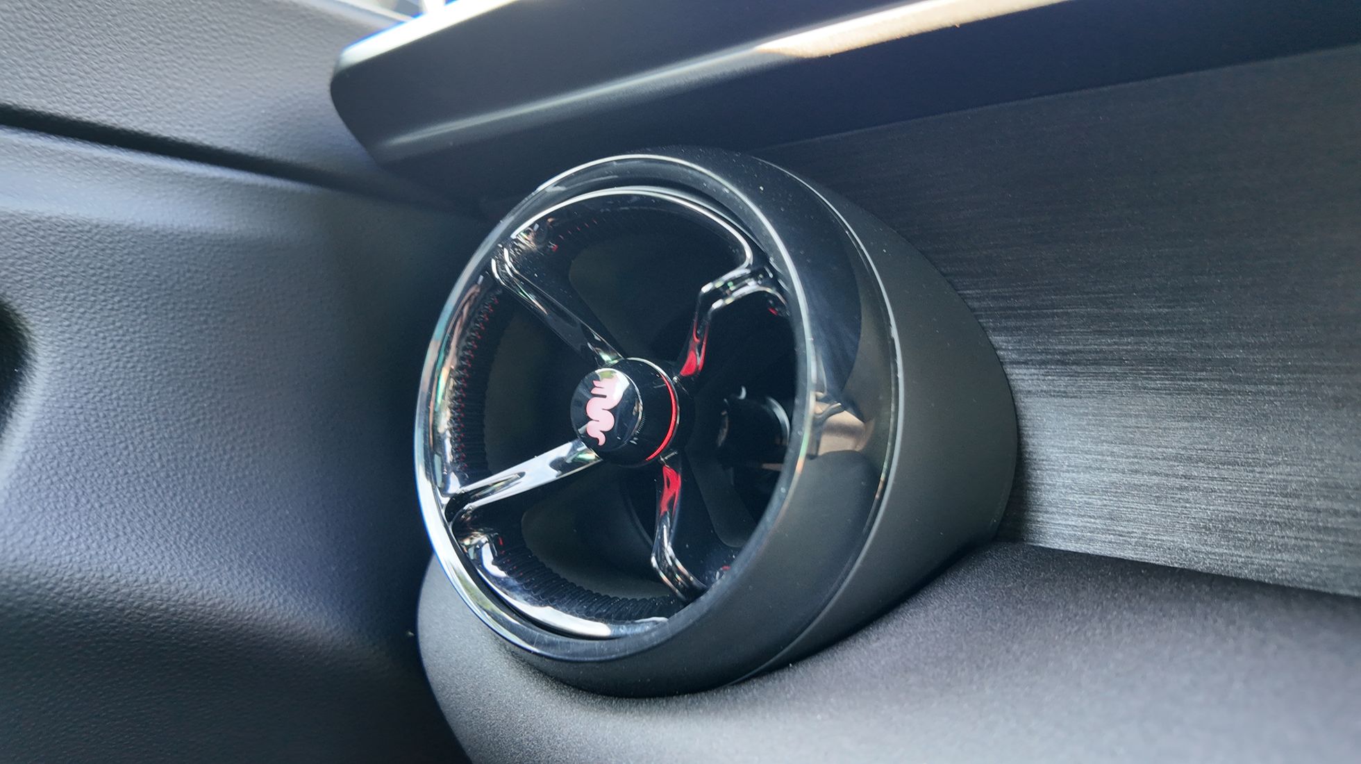 Close-up of the Alfa Romeo Junior Elettrica Veloce circular dashboard air vent with detailing