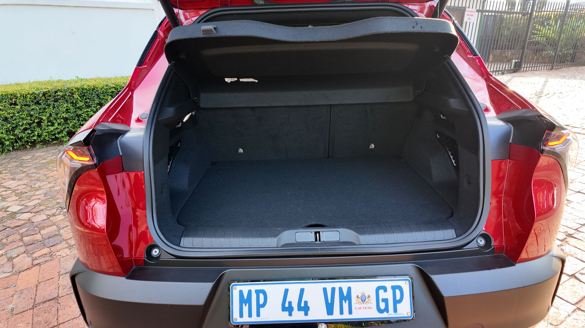 Open boot of the Alfa Romeo Junior Elettrica Veloce showing the luggage compartment and available cargo space.